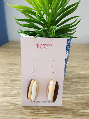 Handmade Chocolate Éclair Earrings by Jazzed Up Bling – polymer clay food jewelry featuring golden pastry with chocolate and cream filling