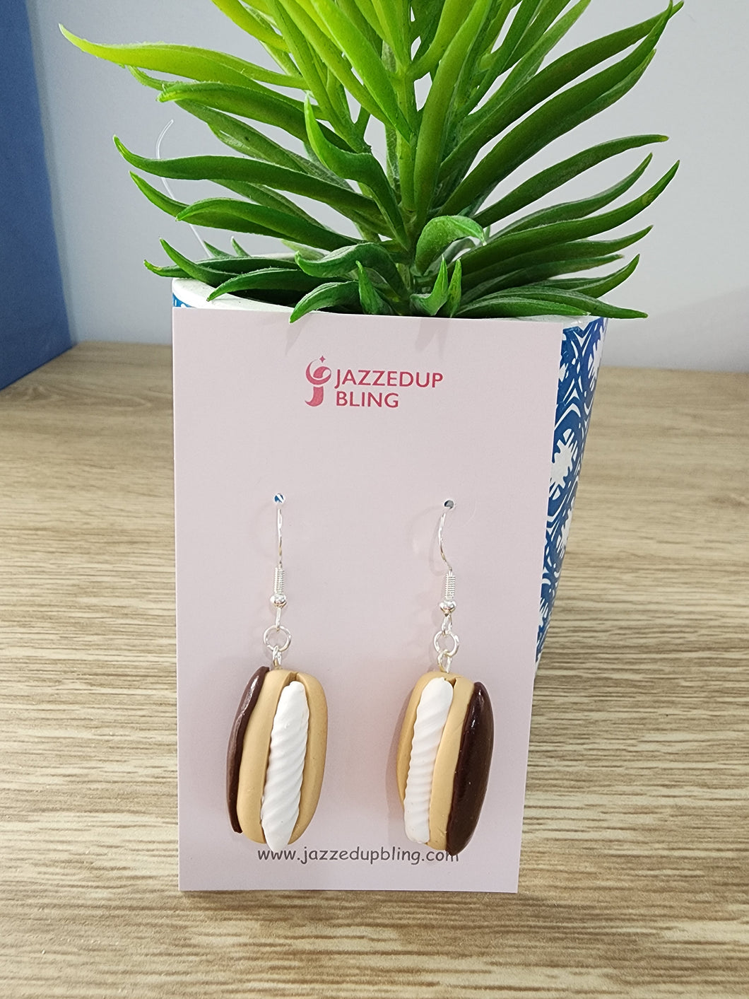Handmade Chocolate Éclair Earrings by Jazzed Up Bling – polymer clay food jewelry featuring golden pastry with chocolate and cream filling