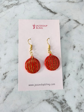 Handmade polymer clay Christmas bauble earrings in red with gold glitter