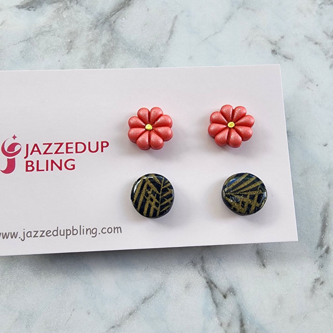 Coral flower and black-gold geometric polymer clay stud earrings from Jazzed Up Bling, handmade in New Zealand.