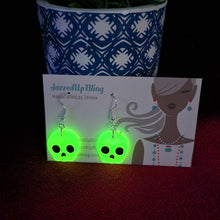 Load image into Gallery viewer, Glow in the dark handmade skull earrings with black eyes – spooky Halloween jewelry NZ

