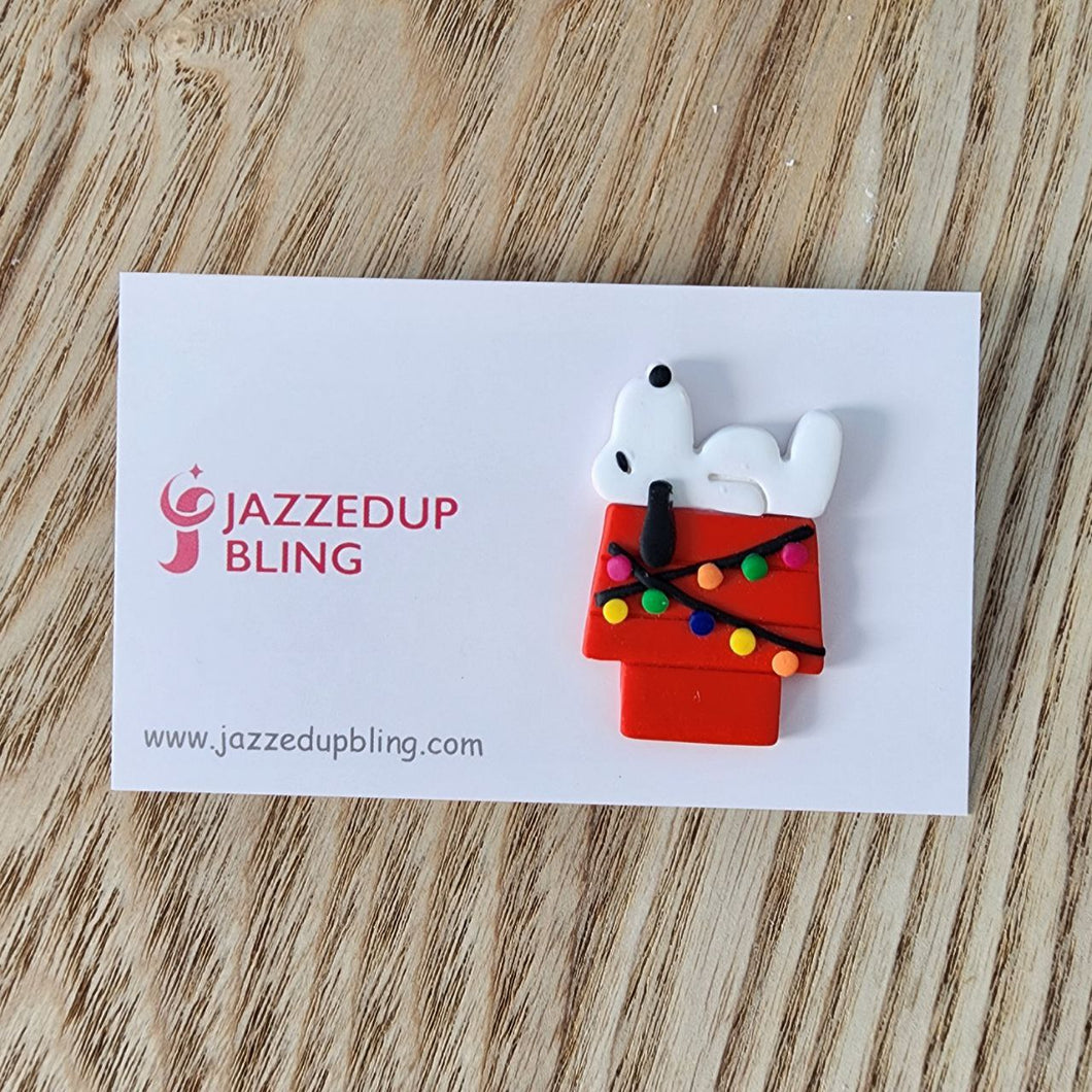 Handmade Joe Cool Christmas brooch featuring Joe Cool on his red doghouse with colorful holiday lights – Jazzed Up Bling NZ.