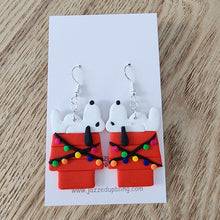 Load image into Gallery viewer, Handmade Joe Cool Christmas dangle earrings showing Joe Cool on a decorated red doghouse with Christmas lights – Jazzed Up Bling NZ.
