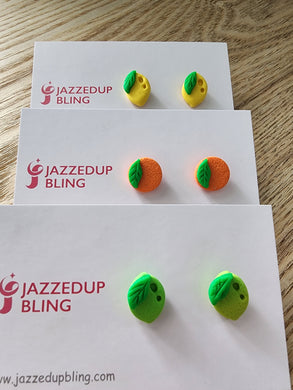 Handmade lemon, lime and orange stud earrings by Jazzed Up Bling – bright polymer clay fruit studs with green leaf.
