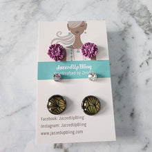 Load image into Gallery viewer, Purple flower polymer clay studs paired with black and yellow vinyl-wrapped round earrings from Jazzed Up Bling, handmade in New Zealand.
