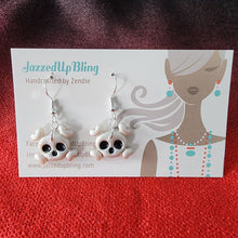 Load image into Gallery viewer, Handmade skull and crossbones earrings in white polymer clay – spooky statement Halloween jewelry NZ
