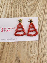 Load image into Gallery viewer, Handmade red glitter Christmas tree earrings with gold star tops by Jazzed Up Bling.

