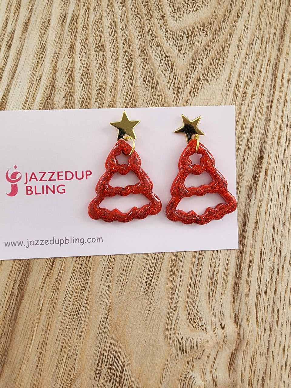 Handmade red glitter Christmas tree earrings with gold star tops by Jazzed Up Bling.