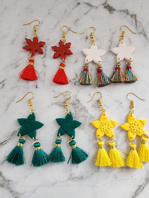 Collection of handmade Star Lantern Parol Earrings in red, white, green, and yellow with tassels, festive Christmas jewelry.