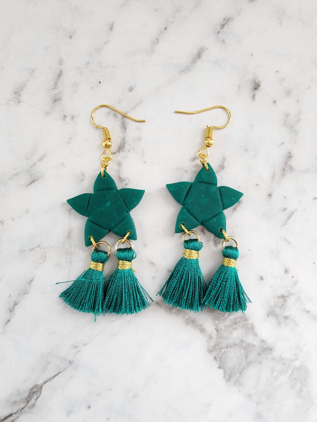 Handmade green star lantern parol earrings with green tassels and gold hooks, festive holiday jewelry.