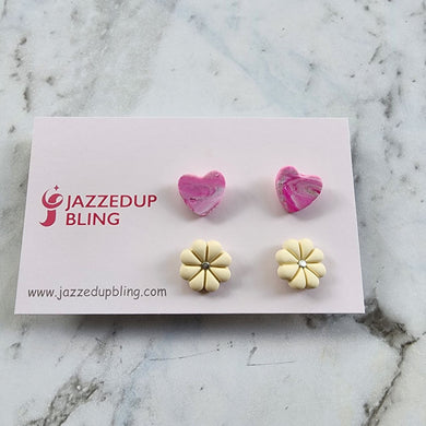 Pink marbled heart and cream daisy polymer clay stud earrings from Jazzed Up Bling, handmade in New Zealand.