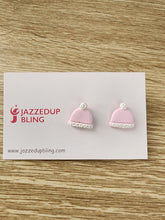 Load image into Gallery viewer, Pink beanie-shaped polymer clay earrings with white trim and pom-poms, handmade by Jazzed Up Bling in New Zealand.

