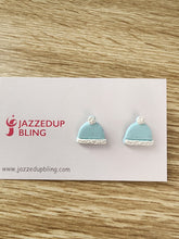 Load image into Gallery viewer, Light blue beanie-shaped polymer clay earrings with white trim and pom-poms, handmade by Jazzed Up Bling in New Zealand.
