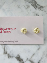 Load image into Gallery viewer, Creamy white knot studs with simple, elegant charm.
