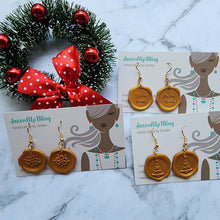 Load image into Gallery viewer, Handcrafted gold wax seal Christmas earrings with festive holiday designs by Jazzed Up Bling.
