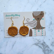 Load image into Gallery viewer, Handmade gold polymer clay wax seal earrings with Christmas tree design by Jazzed Up Bling.
