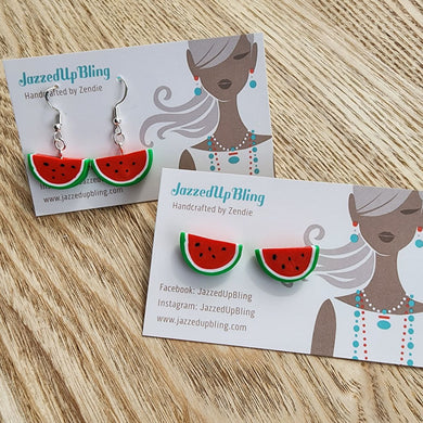 Red and green watermelon earrings in dangly and stud styles.